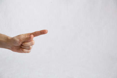 female finger on a white background, finger presses, female handの写真素材
