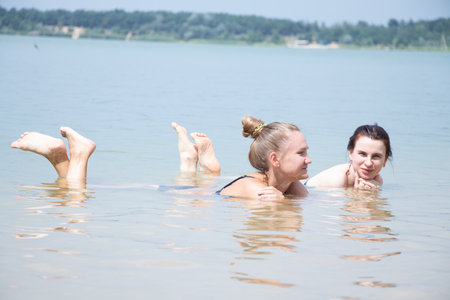 Girls in a bathing suit on the beach in Ukraine in the summer on vacation, a model on the beachの写真素材