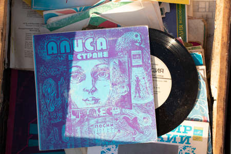 Ukraine Dnipro 21.02.2022 - Old Russian vinyl record with songs Alice in the Starne Miracles, sale at the bazaar, music store, Soviet recordsのeditorial素材