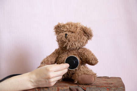 teddy bear brown m stethoscope on isolated background,pediatrics,children's doctor,medicine and...