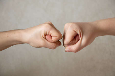 two fists on an isolated background, strength and power, fight and war, stop war, aggression