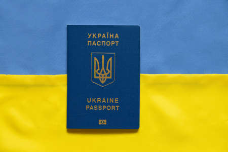 Biometric passport against the background of the flag of Ukraine, yellow-blue, patriotの写真素材
