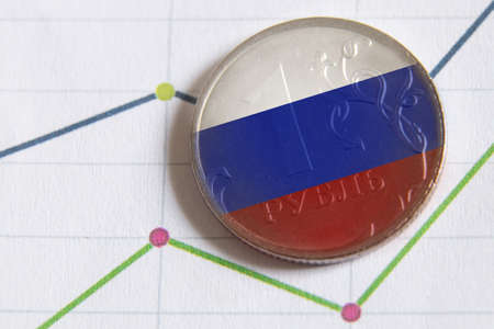 The Russian ruble and the flag of Russia lie on the bar graph. Financial sanctions against Russia. Russian economy and ruble. Crisis in Russia 2022の写真素材