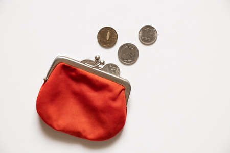 Russian ruble with a purse lie on a white background. Financial sanctions against Russia. The collapse of the ruble. Crisis and sanctions in Russia 2022の写真素材