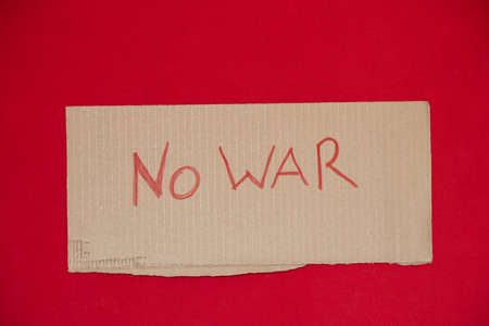 Paper signs with slogans no war on a red background, the war in Ukraine 2022の写真素材