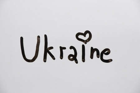 The word Ukraine is written in black on white paper, free Ukraineの写真素材