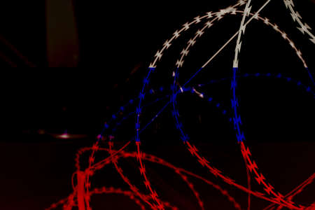 Flag of Russia on the background of barbed wire. War in Ukraine. Stop war and peace in Ukraine,...