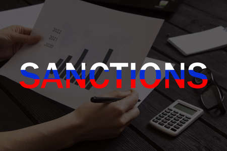 Economic report and histogram with statistics and sanctions text in the colors of the Russian flag. Financial sanctions against Russia. The collapse of the ruble. Russian economy and rubleの写真素材