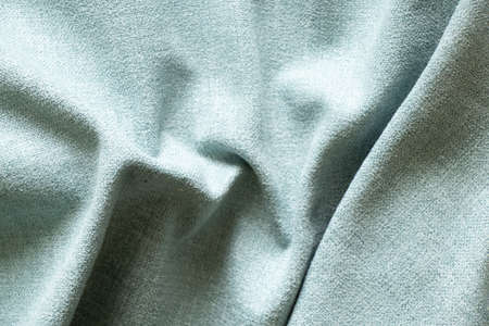 Light blue wrinkled fabric for the background, fabric for the background macro photoの写真素材