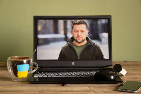 Ukraine Dnipro 01.04.2022 - President of Ukraine Volodymyr Zelensky on the laptop screen at home,...