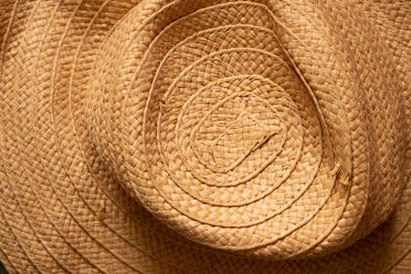 Yellow trendy straw womens hat as a background ,fashion and trend,headwearの写真素材