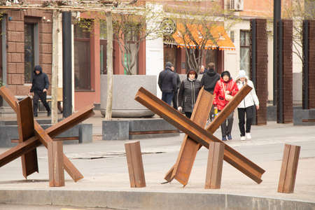 Ukraine Dnepr 20.04.2022 - Anti-tank hedgehogs on the street of a city in Ukraine during the war with Russia, protecting their hometown from Russian tanksのeditorial素材