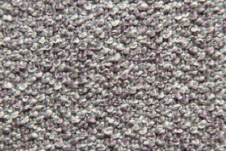 Upholstered gray fabric as a macro photo background, fabrics as an example for upholstered furniture