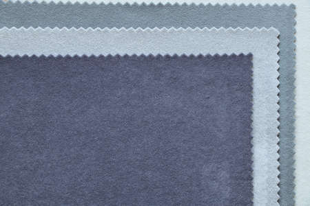 A palette of velor soft fabric in different colors for furniture upholstery as a background...