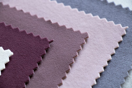 A palette of velor soft fabric in different colors for furniture upholstery as a background...