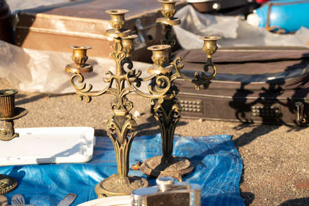 An old candlestick stands in the sun in a bazaar in a city in Ukraine, a retro candlestickの写真素材