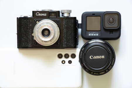 Ukraine Dnepr 30.04.2022 - Camera Smena - USSR 1952, cameras GoPro HERO 9 and Samsung Galaxy A52 and Canon Lens camcorder, photographer's collectionのeditorial素材