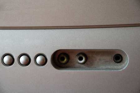 Buttons on an old gray TV close-up, watch TV, on and off buttons on the TV