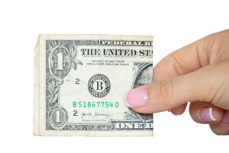 Womans hand holds one dollars on a white background ,business