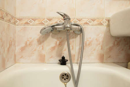 Inside the bathroom , faucet and shower mixer in the bathroom , bathroom in a residential apartment