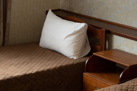 Two single beds and a bedside table with drawers in the bedroom, bedroom, apartment and interior, bedside tableの写真素材