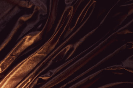 Dark pink wavy fabric as a background, golden background