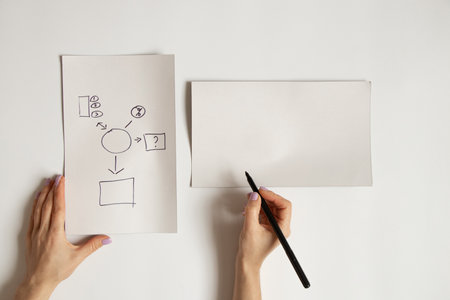 The graph is drawn by hand on white paper on a white background. Place for text and cards, plan and statistics for business as a background.Statisticsの写真素材