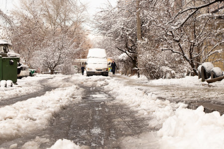 frozen snow from ice on a city street in winter in Ukraineの写真素材