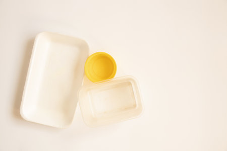 Different old plastic packaging lie on a white background, food containersの写真素材