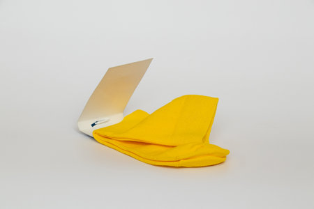 Yellow socks with a label on a white backgroundの写真素材
