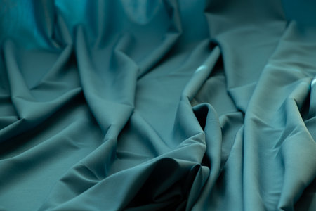 Blue wrinkled plain fabric as backgroundの写真素材