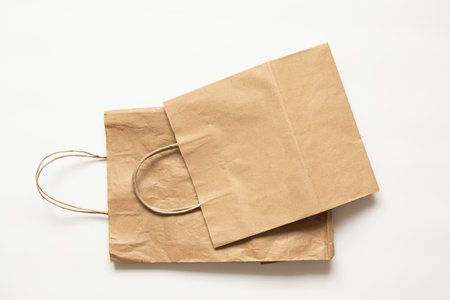 Brown paper packaging bag isolated on white backgroundの写真素材
