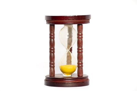 Old hourglass on a white backgroundの写真素材