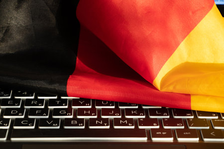 Germany flag lies on a black laptop keyboard closeupの写真素材