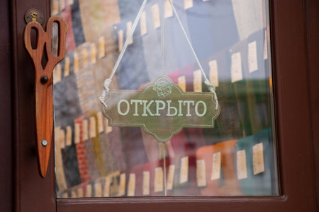 open sign on a glass door of a storeの写真素材