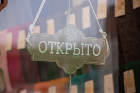 open sign on a glass door of a storeの写真素材