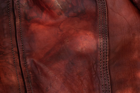 background of red leather jacket crumpled closeupの写真素材
