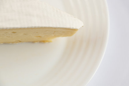 sliced brie cheese close-up on the table