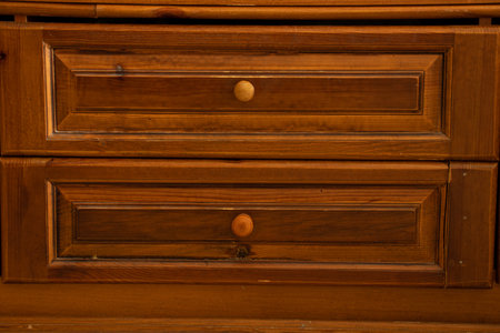 Old wooden chest of drawers with drawers as a backgroundの写真素材
