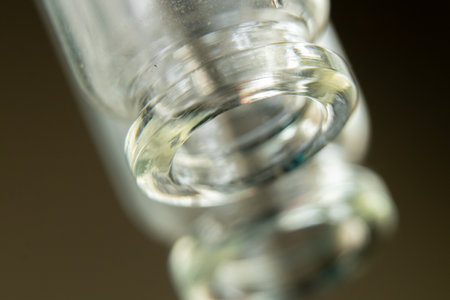 mpty glass medicine vial macro photo,