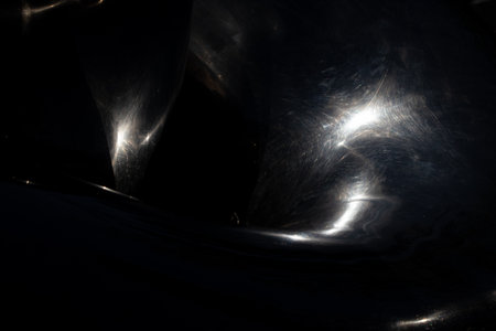 Solar chaotic glare on a black background in mirror reflection, rays of light on black, abstract backgroundの写真素材