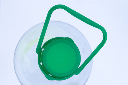 plastic bottle with cap and handle on a white backgroundの写真素材