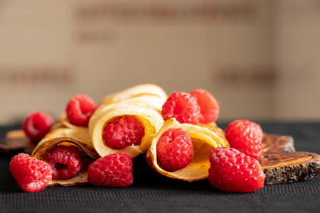 Thin pancakes with raspberries close-up, dessert and breakfastの写真素材