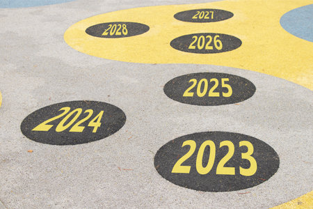 The years from 2023 to 2028 are written on the road in circles on the playground on the floor in Ukraine, achievements and successes in the new year, businessの写真素材