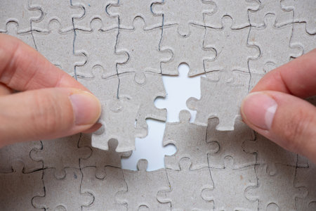 Female hands collects puzzles , achievement and success