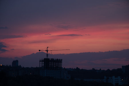 The city of Dnipro in the evening at sunset and pink sky in Ukraine, sunset in the cityの写真素材