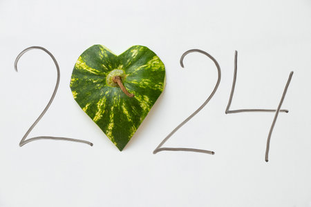 Year 2024 where instead of zero there is a watermelon peel on a white background, happy new year 2024の写真素材