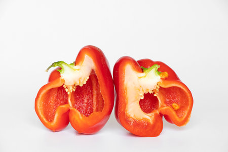 Red bell pepper in a cut on a white background close-upの写真素材