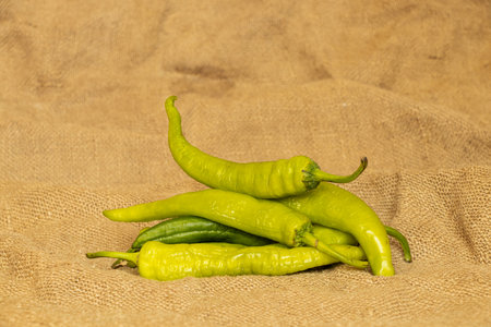 Hot green pepper lies on a burlapの写真素材