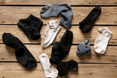 Lots of different socks scattered on the floor of the house, socks lying aroundの写真素材